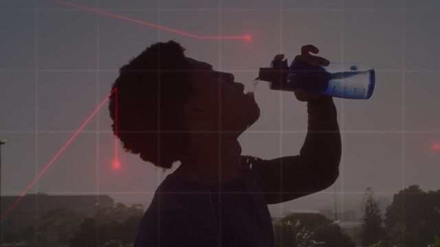 Silhouette of a man drinking water from a bottle with digital data overlay. Suitable for themes such as technology, digital health, hydration, modern lifestyle, and data-driven health tracking.