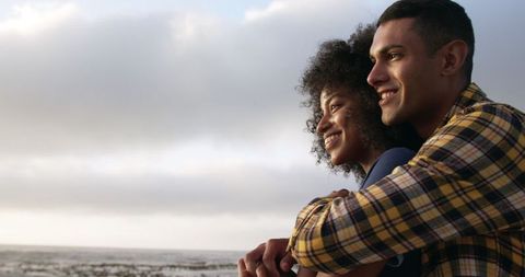 Young Couple Embracing at Scenic Beach - Download Free Stock Images Pikwizard.com