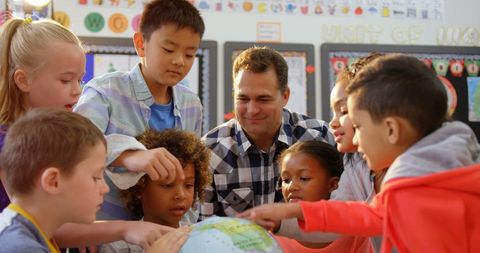 Teacher and Diverse Students Learning Geography with Globe Focusing on Collaboration - Download Free Stock Images Pikwizard.com