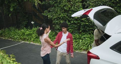 Family packing car for exciting road trip adventure in nature