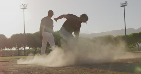 Action-Packed Baseball Player Skidding to Base during Game