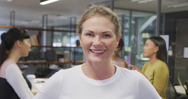 Smiling Businesswoman Leading Office Team Meeting - Download Free Stock Images Pikwizard.com