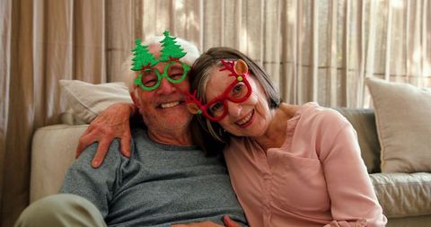 Senior Couple Celebrating Holidays with Festive Eyeglasses