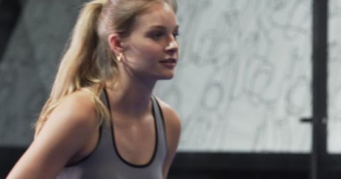 Determined Female Athlete in Action During Workout