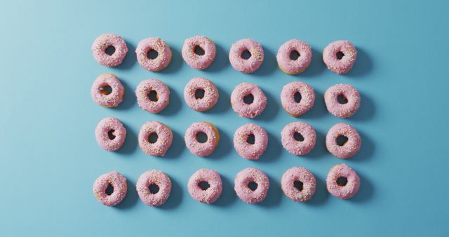 Colorful Pattern of Donuts with Sprinkles on Blue Background - Download Free Stock Images Pikwizard.com
