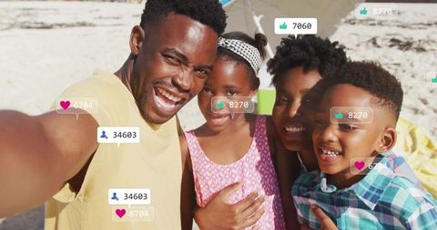 Smiling black family taking selfie on sunlit beach with social media reaction overlays