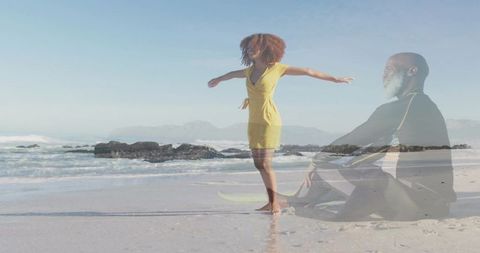 Double-exposure beach portrait showing woman standing in yellow dress and man sitting reflecting