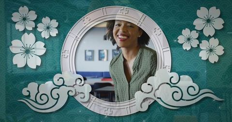 Elegant mugshot of mid adult woman in stylish circular frame