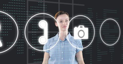 Businesswoman interacting with futuristic digital interface