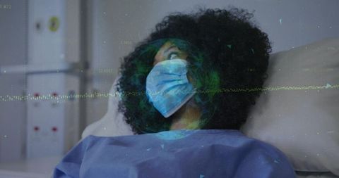 Patient wearing surgical mask on hospital bed with digital data overlay and waveform visualization