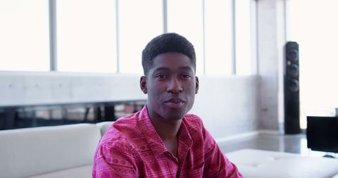Confident Businessman Relaxing in Modern Office