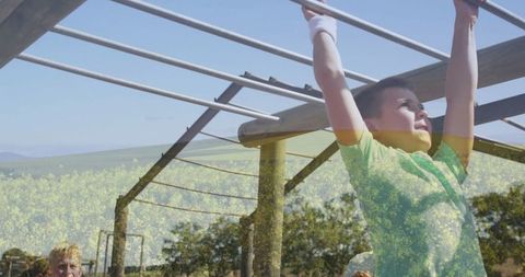 Energetic Child Enjoying Monkey Bars at Outdoor Playground