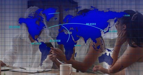 Global analytics team reviewing interactive tablet data with world map overlay boardroom