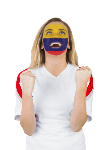 Excited colombian fan with face paint on white background