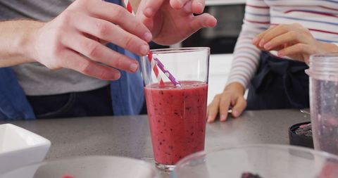 Couple Enjoying Healthy Berry Smoothie