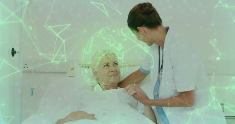 Nurse using technology to monitor patient in hospital