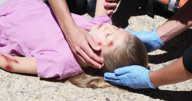 First Responders Assisting Injured Child on Ground - Download Free Stock Images Pikwizard.com