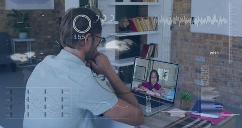 Male teacher video calling student with data graphics overlay