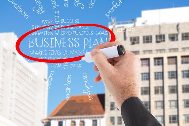 Hand drawing 'Business Plan' text with a marker against a cityscape background. Ideal for illustrating business strategy, entrepreneurship, urban business environments, and planning concepts. Suitable for use in presentations, business blogs, educational materials, and marketing strategies.