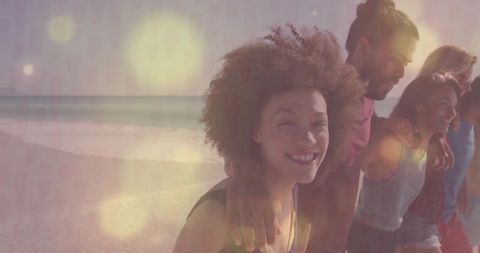 Friends Enjoying Beach Sunset Outdoors with Carefree Smiles