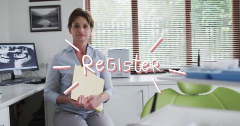 Receptionist organizing patient folders in modern dental clinic