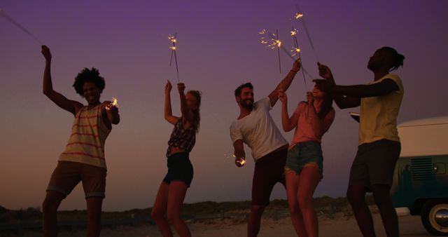 Friends Celebrating with Sparklers at Sunset - Download Free Stock Images Pikwizard.com