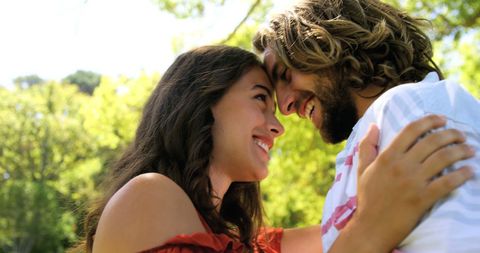 Joyful Smiling Couple Embracing in Sunny Park - Download Free Stock Images Pikwizard.com