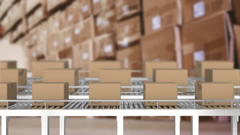 Cardboard Boxes on Conveyor Belts in Warehouse Setting