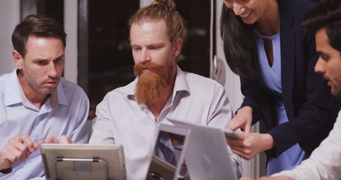 Diverse professionals collaborating in business meeting