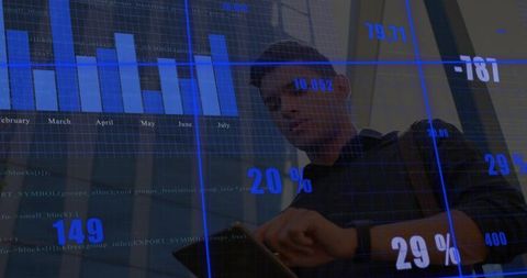 Business professional analyzing tablet with blue analytics dashboard overlay
