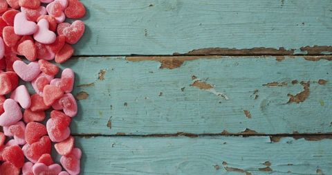 Colorful Heart-Shaped Candy on Rustic Blue Wooden Table