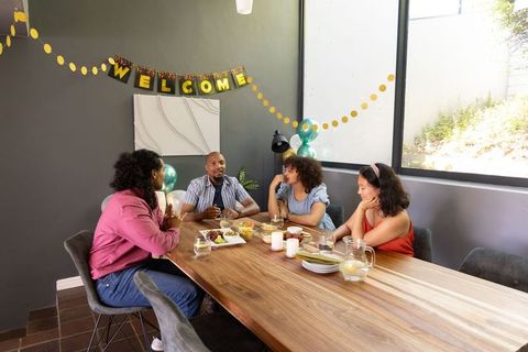 Diverse friends socializing at home celebration gathering