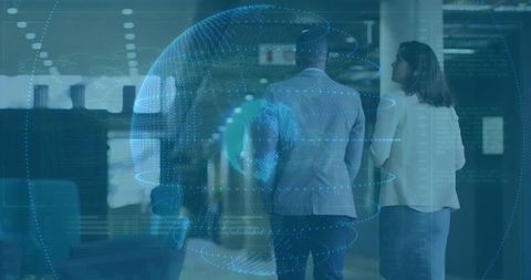 Two professionals walking and discussing strategy with futuristic digital globe overlay