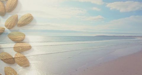 Reflecting low-tide coastal seascape with shelled almonds overlay in pastel minimalist