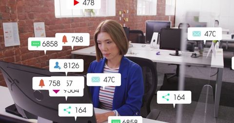 Office worker multitasking with social media notifications