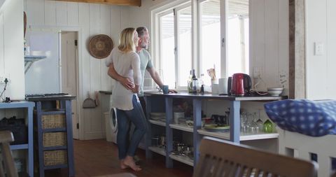 Couple Enjoying Morning Coffee Together in Cozy Kitchen