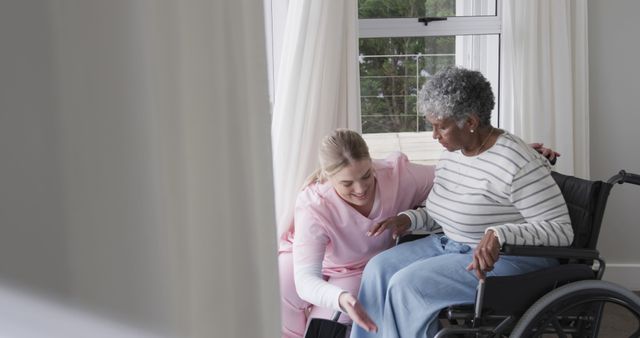 Nurse Assisting Elderly Patient in Wheelchair at Home - Download Free Stock Images Pikwizard.com