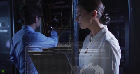 Female IT engineer using holographic HUD in data center, collaborating with colleague