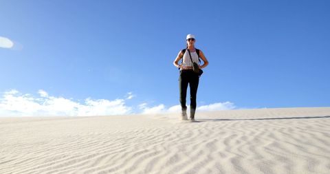 Adventurous Woman Exploring Vast Desert Bluescape - Download Free Stock Images Pikwizard.com