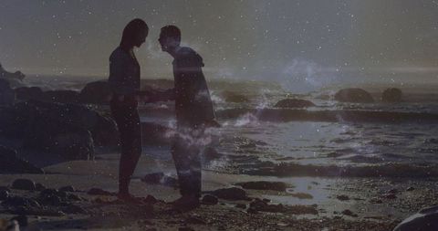 Silhouette Couple Holding Hands at Tranquil Beach at Dusk