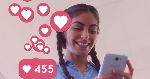 Woman Engaging with Social Media on Smartphone with Heart Reactions
