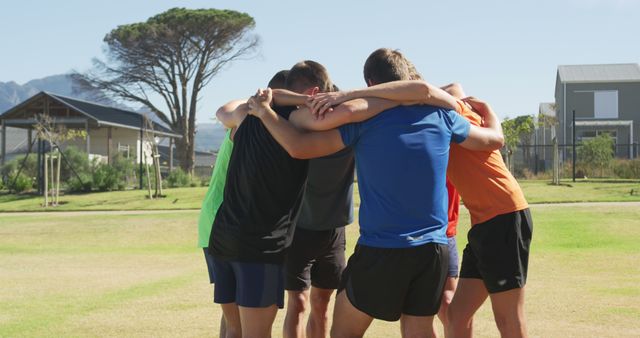 Team Huddle Outdoors Before Game with Scenic Background - Download Free Stock Images Pikwizard.com