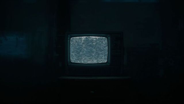 Retro crt television static in dim room embracing nostalgia
