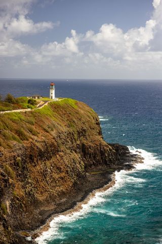 Scenic Lighthouse on Rocky Cliff Overlooking the Ocean