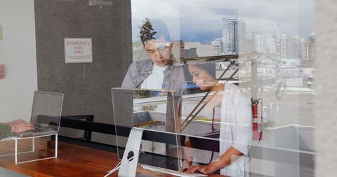 Collaborative Asian Business Team Working in Modern Office