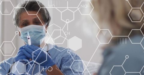 African American Female Doctor Vaccinating Elderly Patient