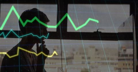 Businessman phone call analyzing stock market data graph