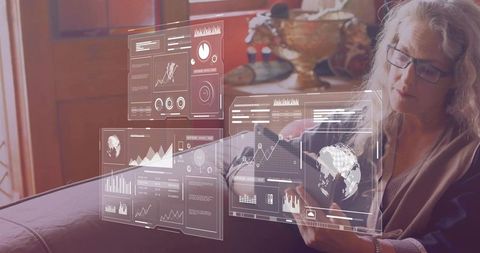 Woman Using Tablet with Holographic Graphs at Home