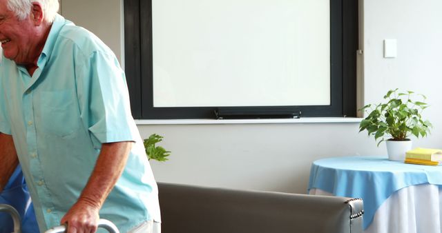 Elderly Man Using Walker in Bright Living Room - Download Free Stock Images Pikwizard.com