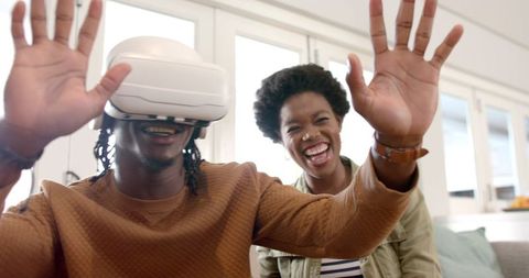 Joyful Friends Experiencing Virtual Reality at Home